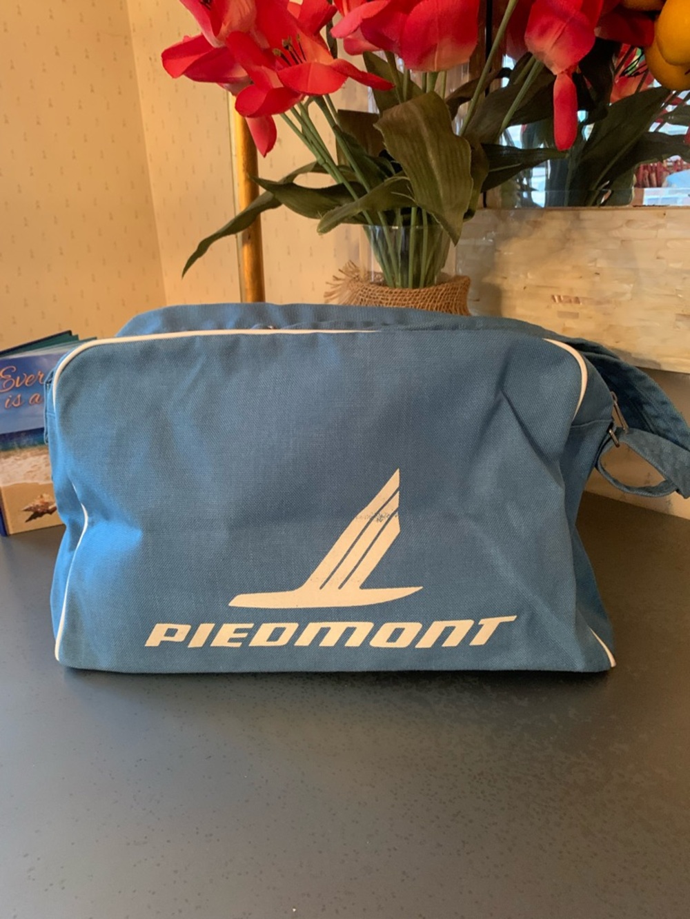 PIEDMONT AIRLINES carry on bag with strap, BLUE with WHITE lettering, zips.